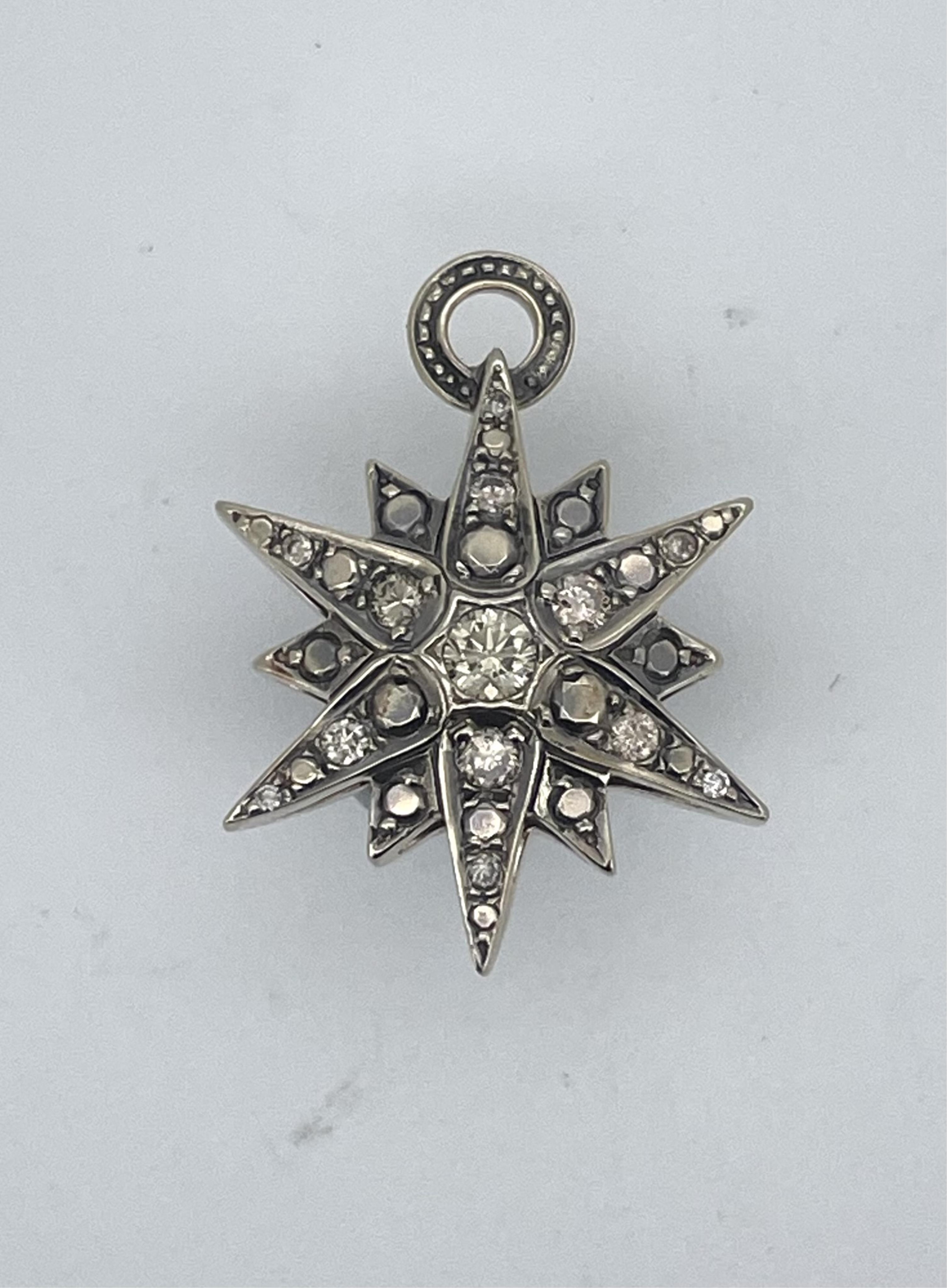 A diamond pendant, designed as star, set to both sides with brilliant-cut diamonds totalling approximately 0.90 carats, length 2.6cm, gross weight approximately 6.5 grams